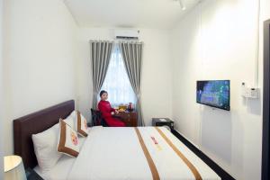 TV a/nebo společenská místnost v ubytování The Rice 131 Bui Vien Hotel