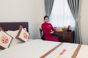 Postel nebo postele na pokoji v ubytování The Rice 131 Bui Vien Hotel