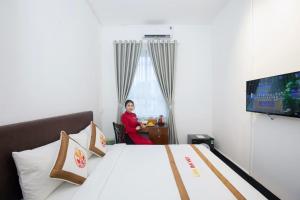 TV a/nebo společenská místnost v ubytování The Rice 131 Bui Vien Hotel