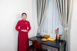 Členové personálu v ubytování The Rice 131 Bui Vien Hotel
