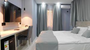 Кровать или кровати в номере Эдельвейс Express