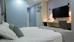 Кровать или кровати в номере Эдельвейс Express
