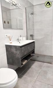 a bathroom with a sink and a toilet at VolKKanrentals Casa Pilar in Famara