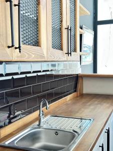 Kuchyň nebo kuchyňský kout v ubytování Renaissance Apart Hotel