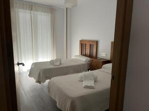 Postel nebo postele na pokoji v ubytování La Azucarera