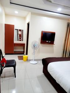 TV a/nebo společenská místnost v ubytování Nairobi Glory Palace Hotel
