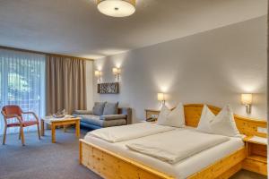 Postel nebo postele na pokoji v ubytování Hotel Erika