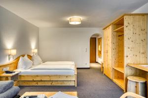 Postel nebo postele na pokoji v ubytování Hotel Erika