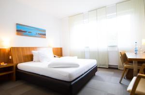 Postel nebo postele na pokoji v ubytování Hotel Darstein
