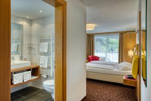 Postel nebo postele na pokoji v ubytování Hotel Erika