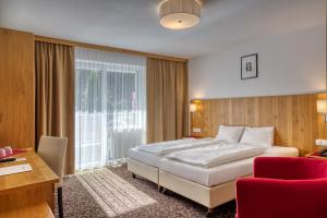 Postel nebo postele na pokoji v ubytování Hotel Erika