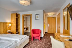 Postel nebo postele na pokoji v ubytování Hotel Erika