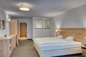 Postel nebo postele na pokoji v ubytování Hotel Erika