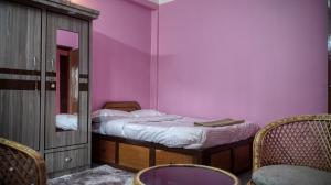 Voodi või voodid majutusasutuse YogStay Homestay in Kathmandu toas