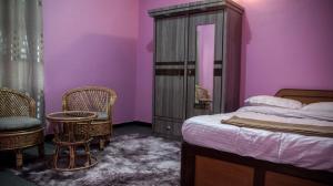 Postel nebo postele na pokoji v ubytování YogStay Homestay in Kathmandu