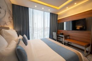 Postel nebo postele na pokoji v ubytování Charli Hotel Jeddah by AHS + 29 fotografií