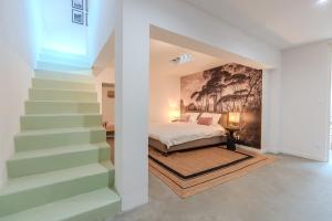 Ένα ή περισσότερα κρεβάτια σε δωμάτιο στο Chambre d'hôte dans un loft cosy en cœur de ville