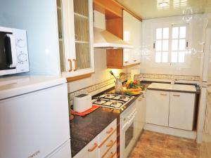 A kitchen or kitchenette at Carmen Seaview & Beach - Apartment