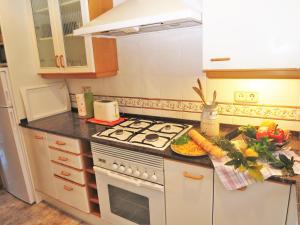 A kitchen or kitchenette at Carmen Seaview & Beach - Apartment