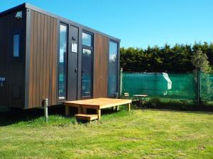 Zahrada ubytování Okuti Cottage by Tiny Away + 6 fotografií
