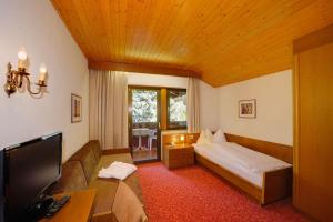 TV a/nebo společenská místnost v ubytování Hotel Laurin