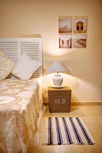 Voodi või voodid majutusasutuse La Terra dei Mari Room & Relax toas
