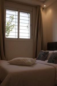 Postel nebo postele na pokoji v ubytování Jolie appartement à Ifrane calme et spacieux