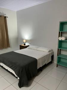 Postel nebo postele na pokoji v ubytování Sabiá Suítes