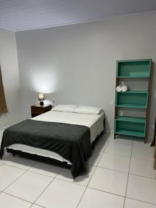 Postel nebo postele na pokoji v ubytování Sabiá Suítes