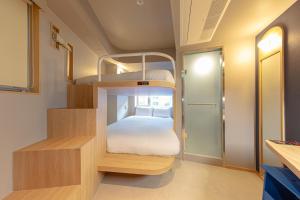 Katil atau katil-katil dalam bilik di Uhoostay Myeongdong Guesthouse