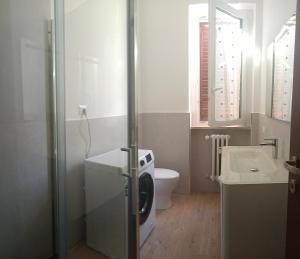 a bathroom with a toilet and a sink at cristina in Pavia +12 photos