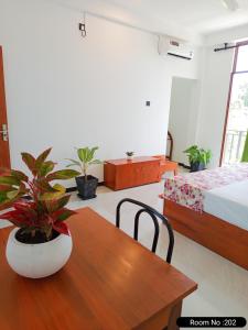 Postel nebo postele na pokoji v ubytování Randon Resort Mirissa