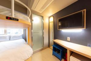 Katil atau katil-katil dalam bilik di Uhoostay Myeongdong Guesthouse