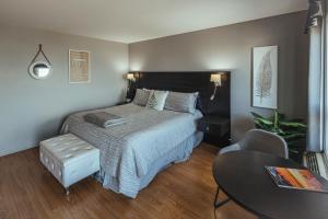 Posteľ alebo postele v izbe v ubytovaní Motel le Point de Vue
