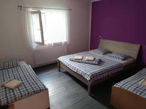 Rúm í herbergi á Pension Archa Mikulov