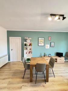 a dining room with a wooden table and chairs at La Casa di Enea in Rome +6 photos