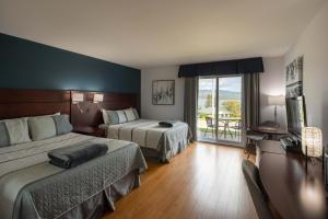 Posteľ alebo postele v izbe v ubytovaní Motel le Point de Vue