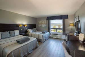 Posteľ alebo postele v izbe v ubytovaní Motel le Point de Vue