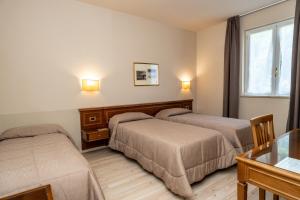 Postel nebo postele na pokoji v ubytování Hotel Valentino + 37 fotografií