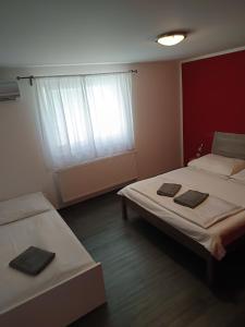 Rúm í herbergi á Pension Archa Mikulov