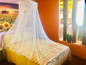 Una cama o camas en una habitación de The Hippie Palace a sublime experience
