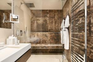 Ванная комната в Villa Cosy, hotel & spa