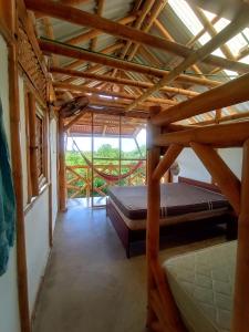 Postel nebo postele na pokoji v ubytování Casa de Guadua