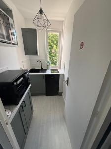 Η κουζίνα ή μικρή κουζίνα στο Bienvenue chez vous +8 φωτογραφίες