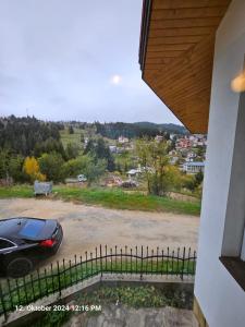 a view of a car parked in a parking lot at Villa Dilyanka Stokite in Stoykite