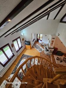 an overhead view of a living room with a staircase at Villa Dilyanka Stokite in Stoykite