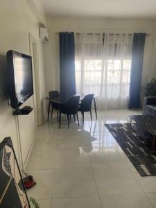 TV a/nebo společenská místnost v ubytování Appartement F2 Cosy Dakar Plateau + 9 fotografií