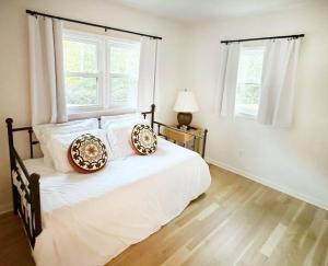 a bedroom with a bed with two pillows on it at Alpharetta Home-5Brooms-6Bds-12Guests in Alpharetta