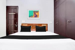 Postel nebo postele na pokoji v ubytování Hotel O Shubham Guest House + 21 fotografií