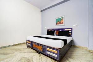 Postel nebo postele na pokoji v ubytování Hotel O Shubham Guest House